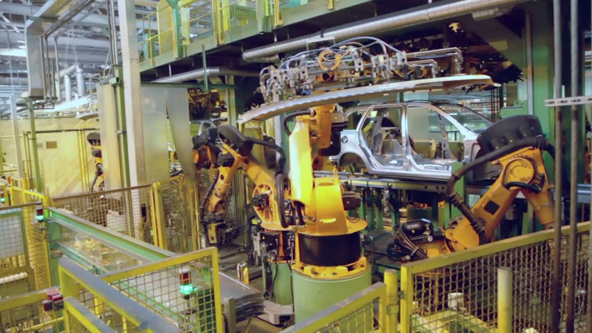 Robotics assemble automobile at conveyer in factory workshop