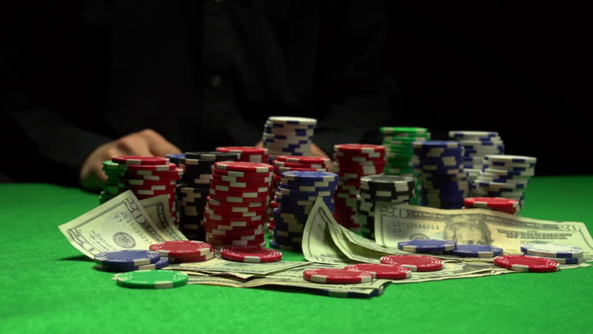 Poker player wins and grabs money