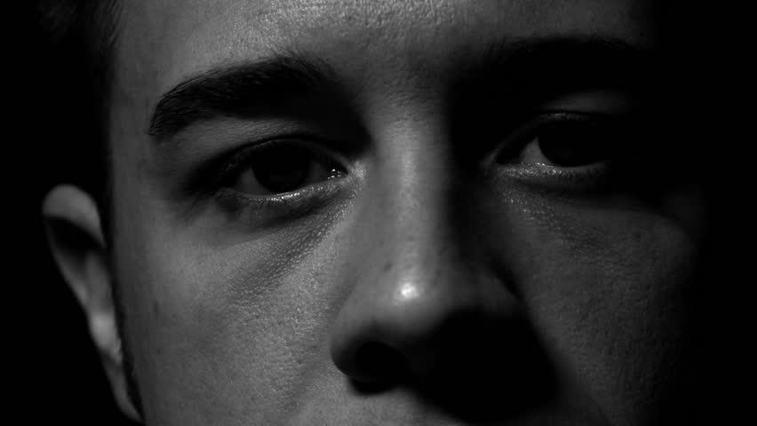 Man's eyes in black and white. Experimental lighting. 