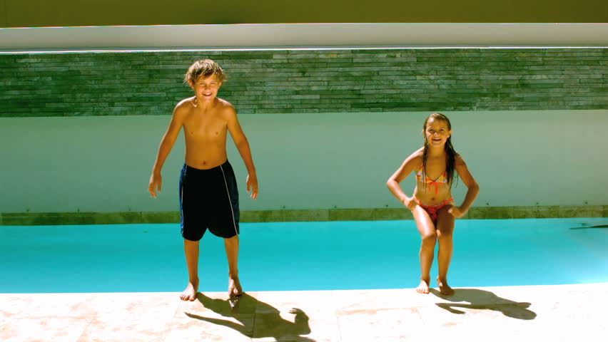 Brother And Sister Diving Into The Swimming Pool In Slow Motion At 250