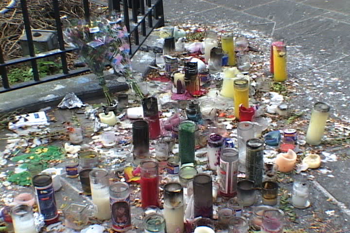 NEW YORK CITY - SEPTEMBER 29, 2001: Hundreds of burned candles left on the ground in Brooklyn park in memory of 9/11.