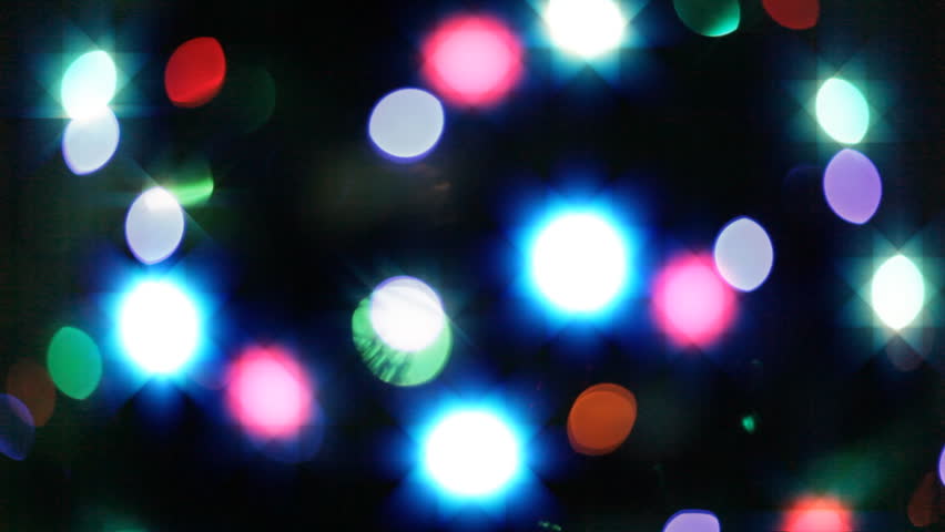 HD loopable video of blurred blinking Christmas lights.
