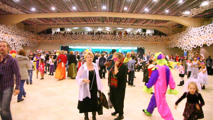 MOSCOW - JAN 04: Parents and children having fun in Forum hall Moscow New Years masquerade of Moscow families, on Jan 04, 2012 in Moscow, Russia.