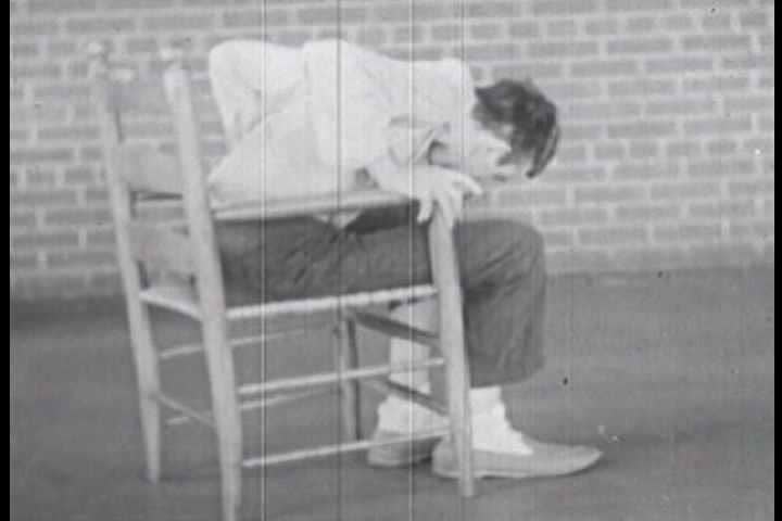 1940s - Silent footage from a lunatic asylum in the 1940s with patients displaying various forms of psychological disorders, particularly catatonic states.