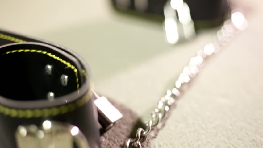 BDSM or dominance and submission for short bondage cuffs for restricting persons freedom, doing with it whatever the dominant partner wants. Quality leather cuffs with locks.