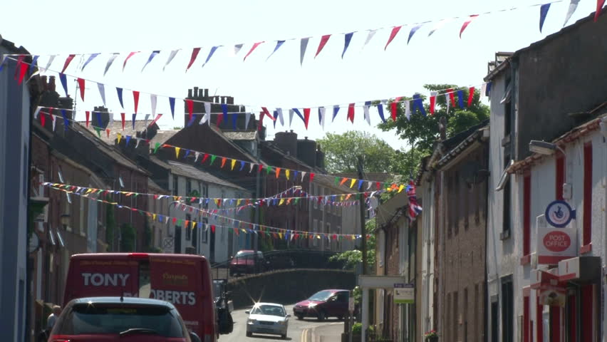 CUMBIA, UK - AUGUST 2012: Bunting flags lining the street of a village.