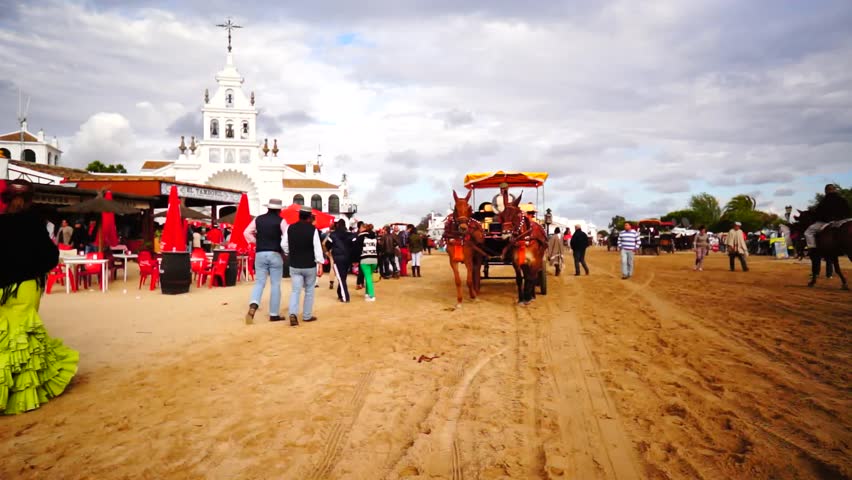 El ROCIO, ANDALUCIA, SPAIN - MAY 19: Pilgrims, people attend to the Sanctuario de Nuestra Senora de El Rocio in one of the most famous religious pilgrimage of Spain. May 19, 2013 in el Rocio, Spain