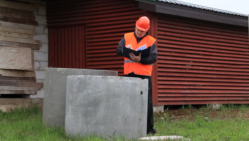 Building inspector with a folder near unfinished house episode 2
