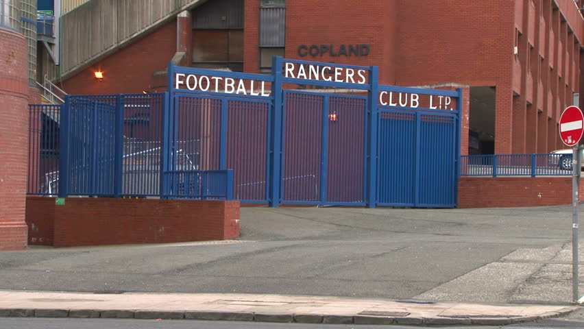 GLASGOW, SCOTLAND - FEBRUARY 2012: The iconic blue gates of Rangers Football Club leading into the Ibrox Stadium in Glasgow.