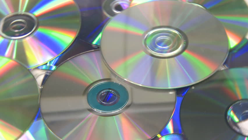 CD DVD rotating on white background