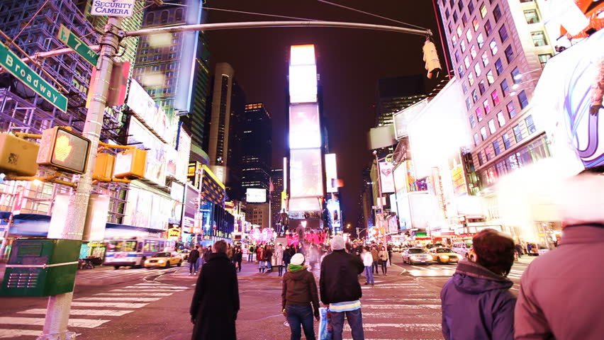 Time Lapse of busy street action on Times Square at night with brands blurred away smoothly / HD1080 / 29.97fps 