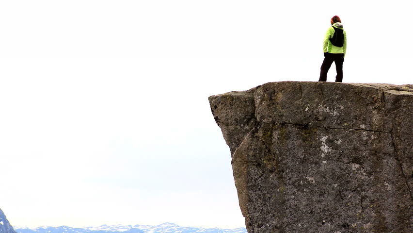 Lone young female on top of the world achieving her ambitions