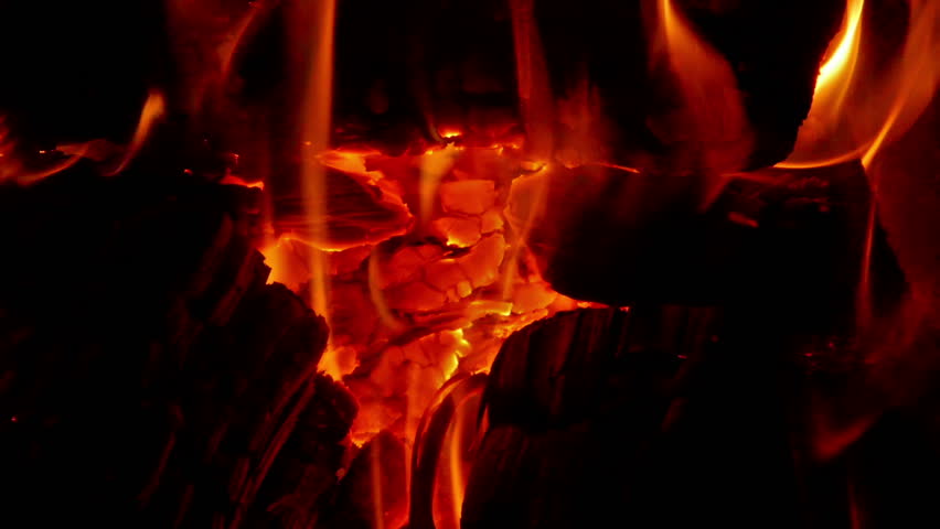 Close up footage of burnt wood in the fireplace.