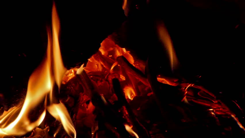 Close up footage of burnt wood in the fireplace. 