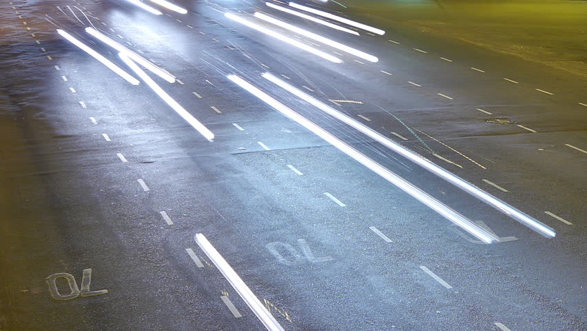 Traffic in the city. Avenue Time-Lapse, Night. Heavy traffic / jam / flowing with blurred motion. Dusk. Crane pan / zoom.
