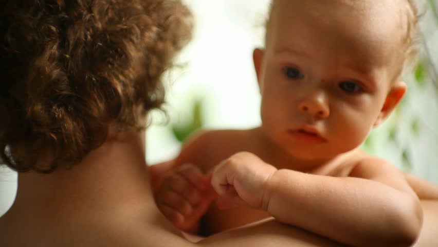 small child in a father's hands