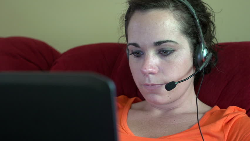Customer service representative working form home laughing