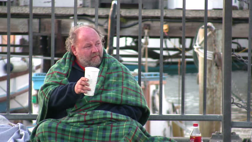 SAN FRANSISCO CA - APRIL 1: Homeless Man asking for money on the side of a busy street on April 1, 2009 in San Fransisco, CA. 
