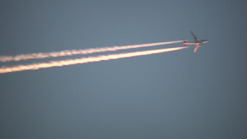 Condensation vapour trails are left behind from a passing airplane.  Also known as contrails, cirrus clouds, or wingtip vortices.