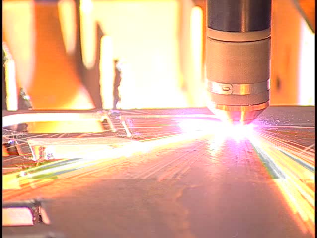 clip of a plasma cutter, cutting out metal in a warehouse 