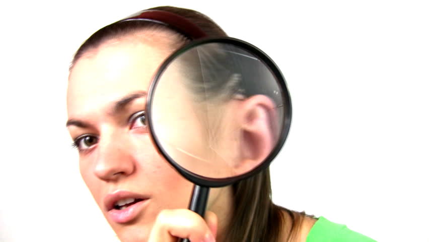 Curious woman looking through a magnifying glass - 1080p 