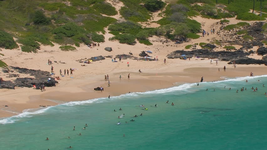 People having fun at the Makapuu beach in Oahu, Hawaii
