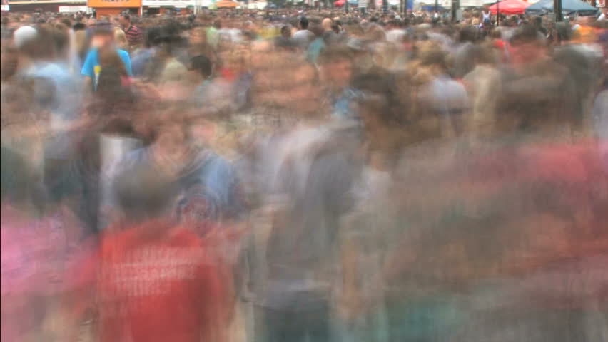 Time lapse with motion blur of thick crowd of people 