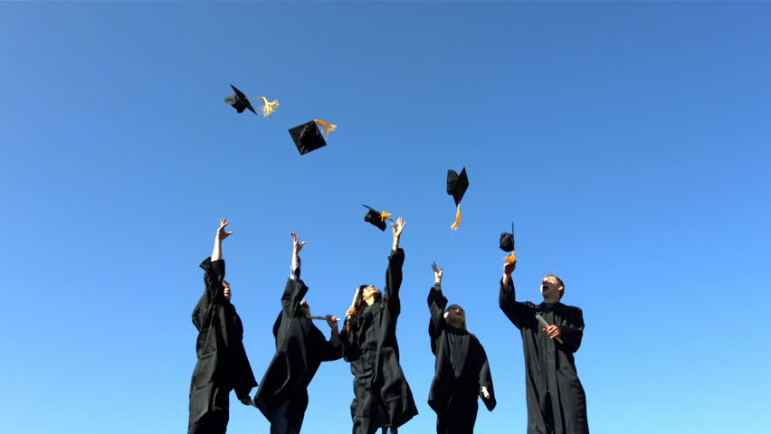 Graduates toss caps into sky