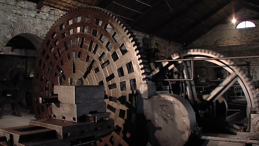 Old machine with big cogwheel