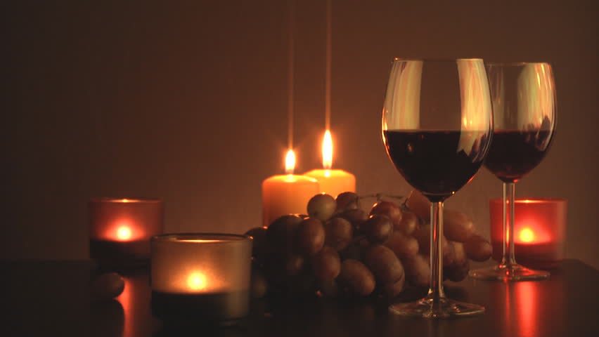 Wine glasses is highlighted by the candles
