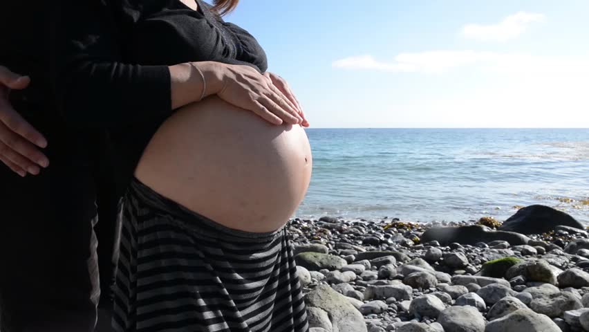 Pregnant Woman Rubbing Her Belly On The Beach Stock Footage Video 5016152 Shutterstock 