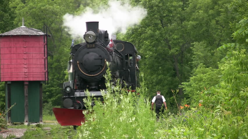 WAKEFIELD - JULY 1: An antique steam train is slowly backed up, Wakefield, Quebec, Canada, July 21, 2009. Built in Sweden in 1907 the train now works in Canada transporting tourists.