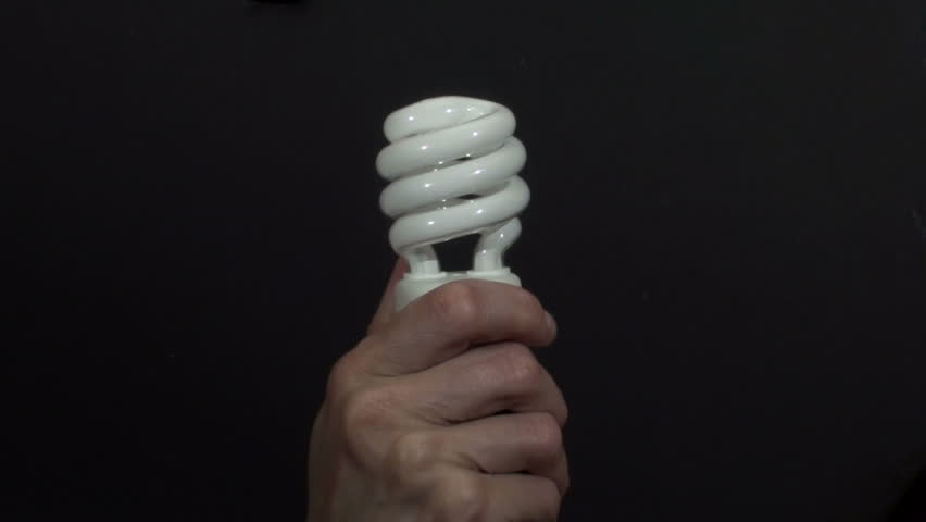 Hand holds energy saving  light-bulb - HD