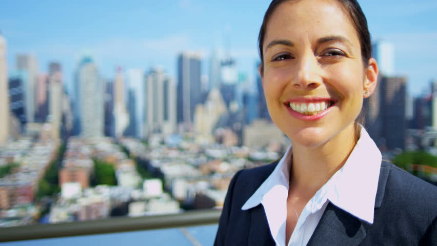 Portrait of successful Caucasian businesswoman on rooftop overlooking Manhattan shot on RED EPIC, 4K, UHD, Ultra HD resolution
