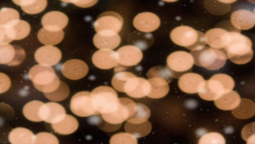 White decorative Christmas lights with snow falling in the foreground. Both are soft focused in this holiday seamless motion loop. HD widescreen.