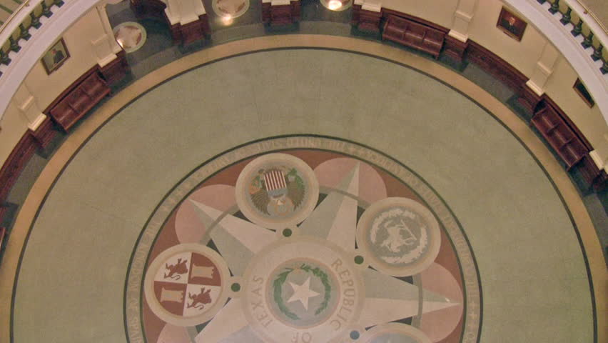 Video of State capital of Texas. Austin Texas. Inside government complex showing the historic designs. Rotunda dome with extensive decorations and numerous floor rails. Rotunda decorative tile floor