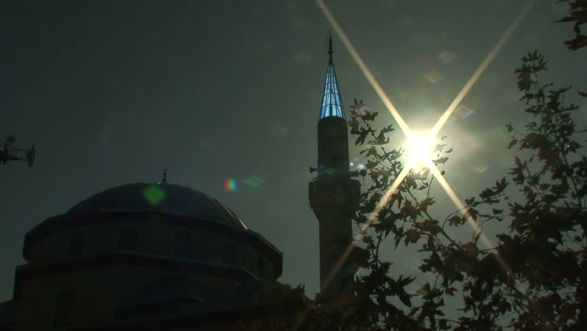 Sunlight behind minaret on Turkish Mosque