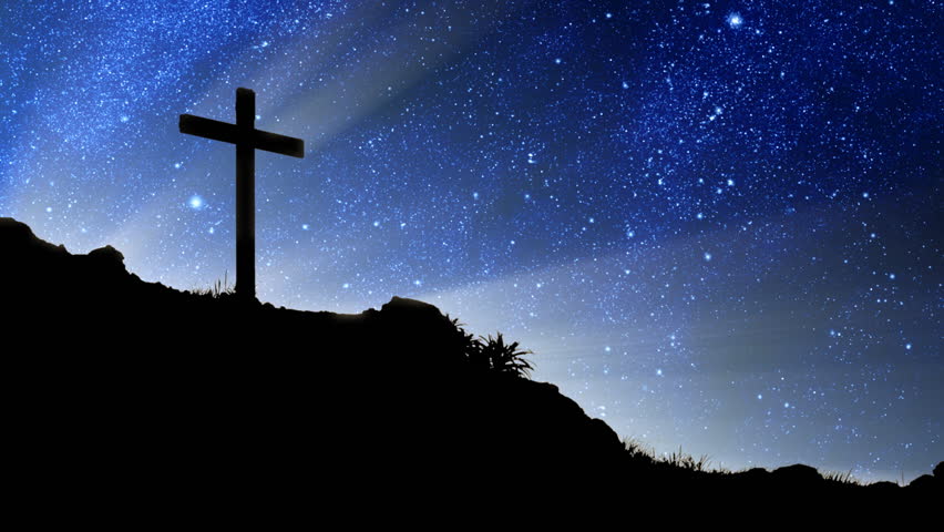 The heavens spinning behind a silhouette of Jesus' cross on Calvary.