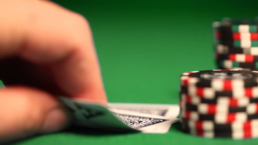 Stack of chips and two aces