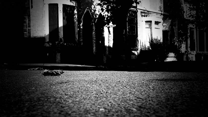 Eerie ghostly shadow comes across an urban street scene