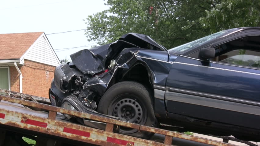 Car in accident put on Tow Truck