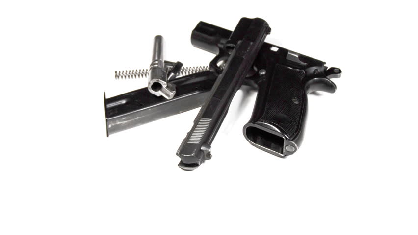 real 3D rotating dismantled pistol isolated on white