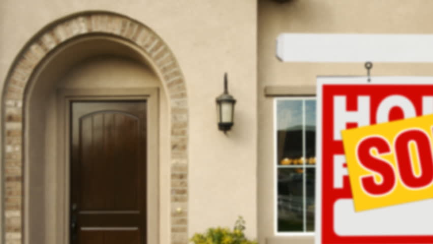 Panning Sold Home For Sale Sign and House.
