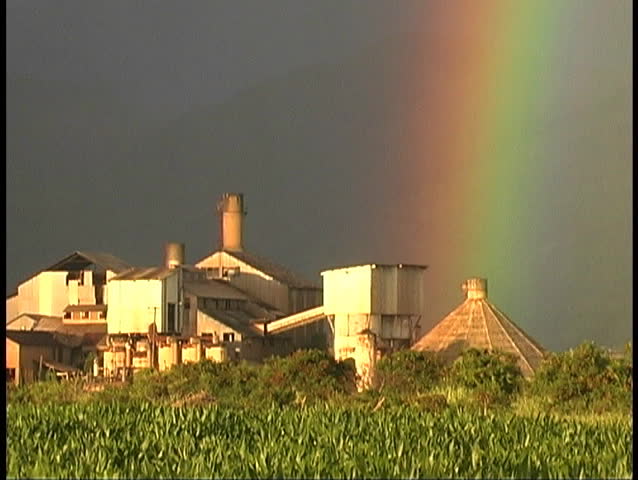 Zoom out from intense rainbow at Hawaii Sugar Mill