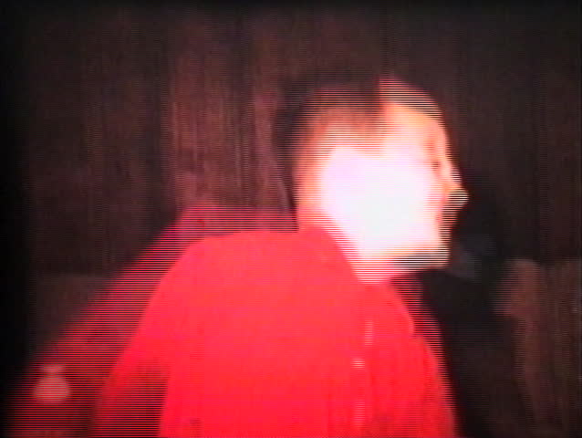 A hyper fun loving little boy breaks out into a crazed dance fever in the living room.