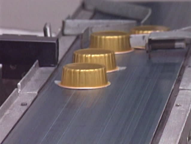 Canned liver pate on the conveyor belt