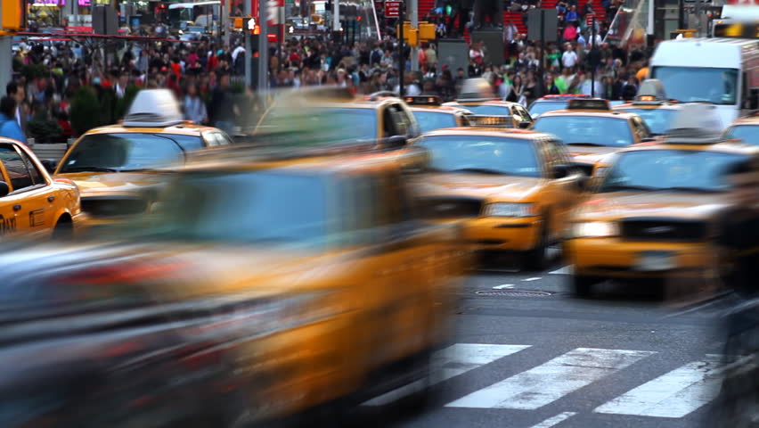Time lapse of city traffic and pedestrians