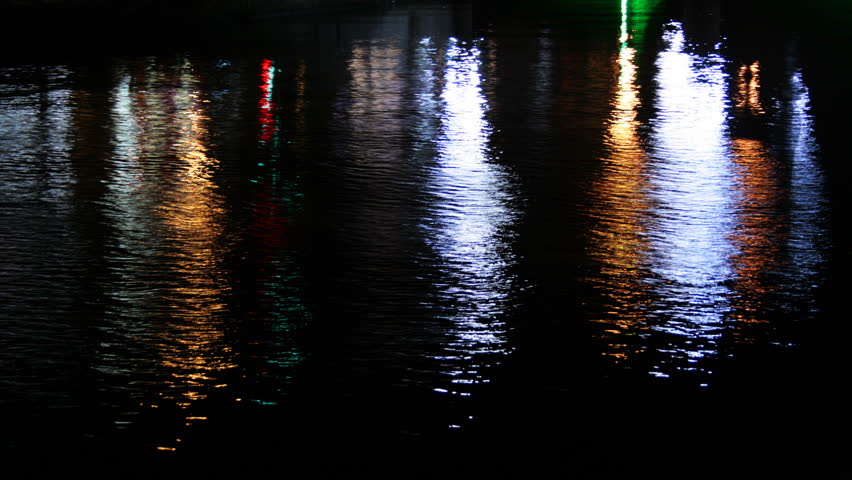 Water reflexions of colorful city lights, time lapse HD video