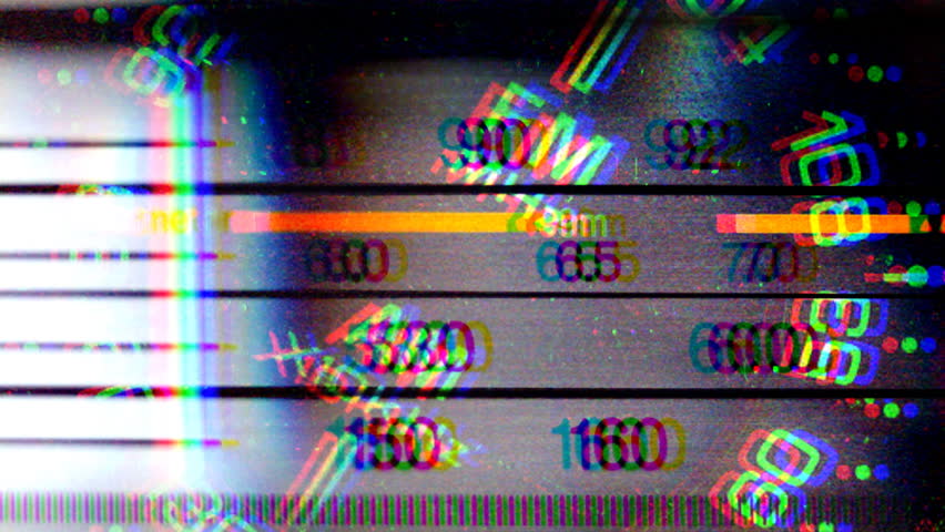 an analogue radio dial tuning in different radio frequencies