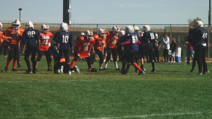 Youth football teams enjoy full contact game-running play; HD audio